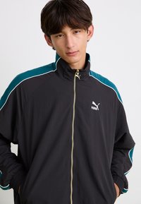 Puma T7  PLAY.LOUD. TRACK - Tréning dzseki - puma black