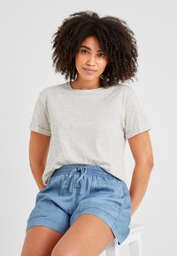 Light gray t-shirt with multicolored specks, round neckline, and short sleeves, paired with light blue drawstring shorts featuring front pockets.
