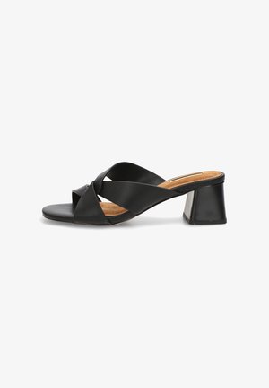 Sandalia mule negra de punta abierta con anchas correas cruzadas, tacón bajo de bloque y plantilla acolchada color cuero claro.