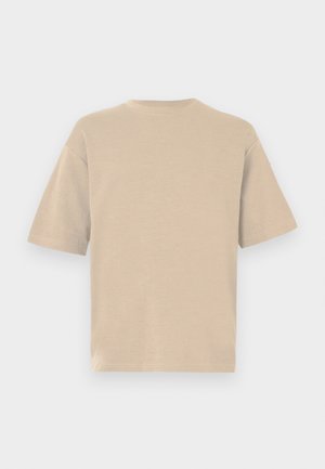 Bež majica kratkih rukava s okruglim izrezom. Mekani materijal s glatkom teksturom. Jednostavan, bez ukrasa dizajn, prikazan s leđa.