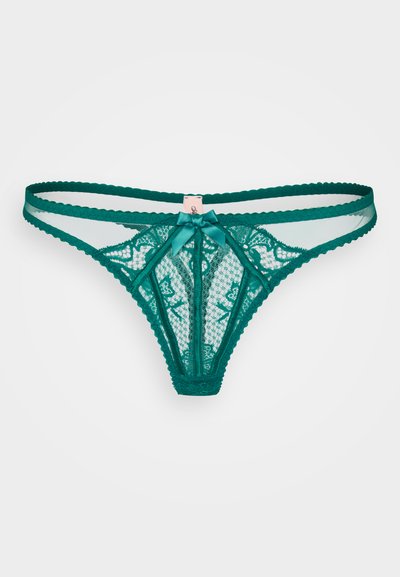 Teal spetsstringtrosor med ett blommönster, med genomskinliga mesh-sidor och en satinrosett i mitten, avslutade med vågiga kanter.