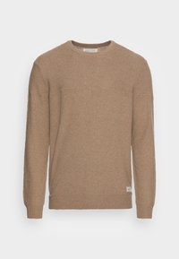 Beige neulepaita pyöreällä kaula-aukolla, teksturoidulla kuviolla, resorilla varustetut hihansuut ja helma. Sivussa pieni brändilaatta.