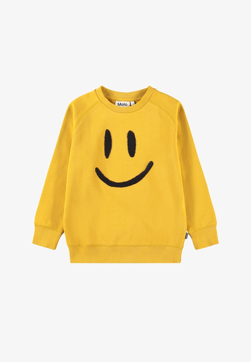 Sweat-shirt jaune à manches longues avec un dessin de visage souriant noir sur le devant et un col rond, étiqueté "Molo" à l'intérieur du col.