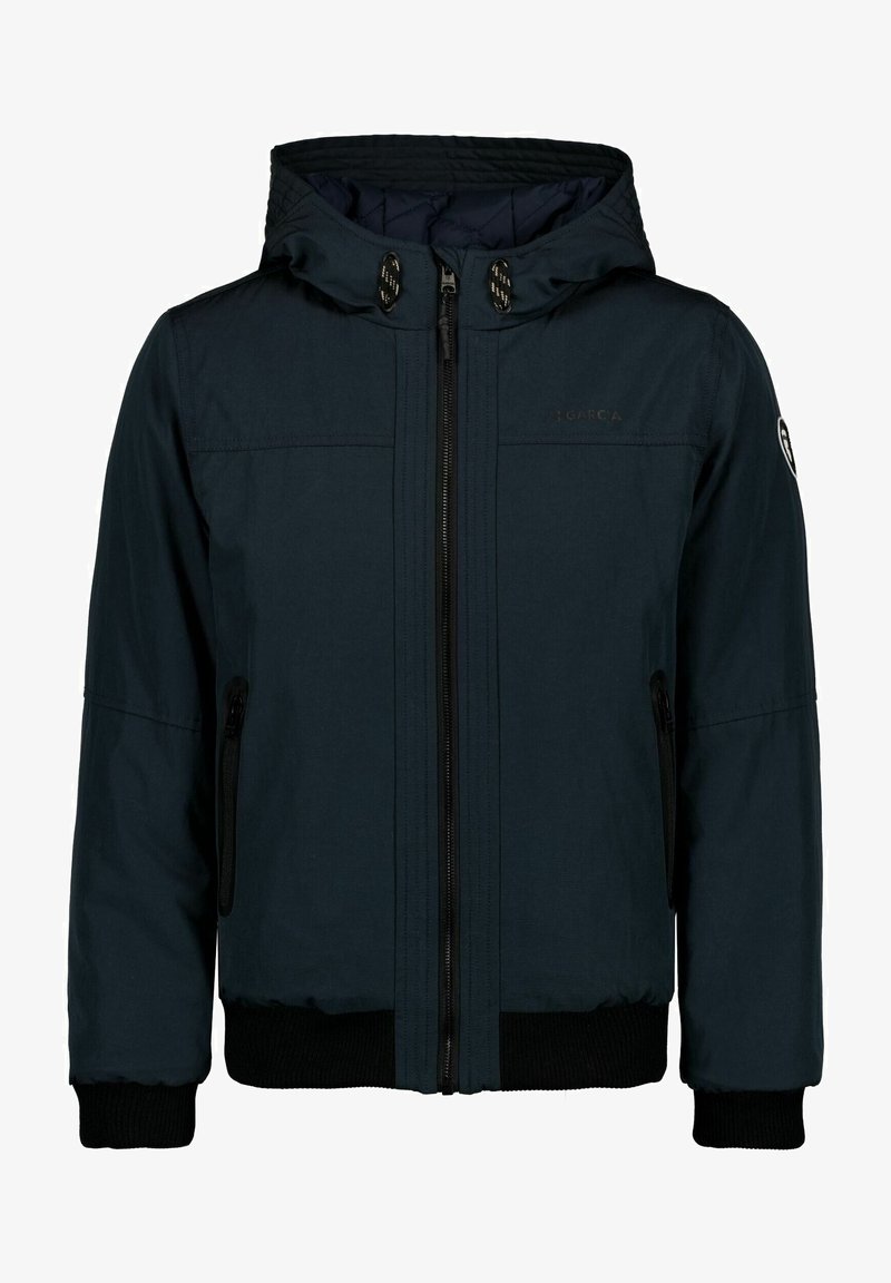 Veste à capuche zippée de couleur bleu marine foncé avec cordon de serrage, poches zippées sur les côtés, poignets et taille côtelés, ornée d'un petit logo sur la manche gauche.