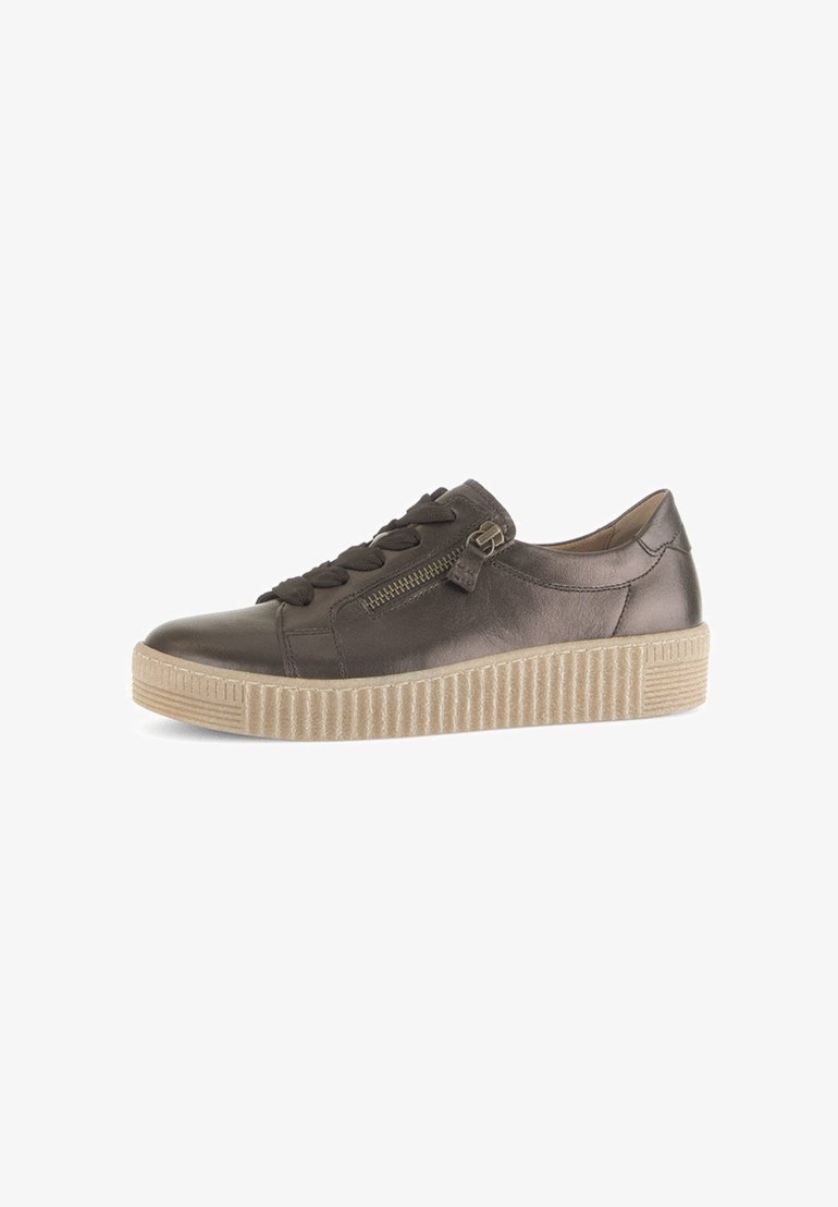 Brown leather sneaker with a rounded toe, and a textured beige sole. Features a side zipper and lace-up front for adjustable fit.