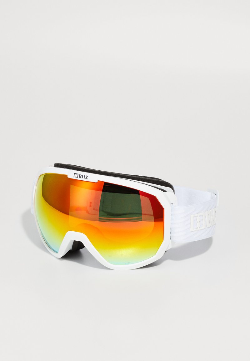 Slēpošanas brilles ar baltu rāmīti, spoguļainām oranžām lēcām un mīkstu melnu iekšējo oderi. Regulējams balts siksniņš ar zīmola logotipu.