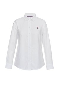Chemise blanche à manches longues avec boutons, col et petit logo brodé sur la poitrine gauche, présentée sur un fond uni.