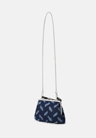 Navy fabric purse with floral pattern, silver clasp closure, and chain strap. Compact design with a textured finish and rounded shape.