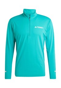 Tyrkysový pulovr s dlouhým rukávem a zipovým límcem, vyrobený z hladkého materiálu; na levé části hrudi se nachází bílé logo "TERREX" a bílé detaily.