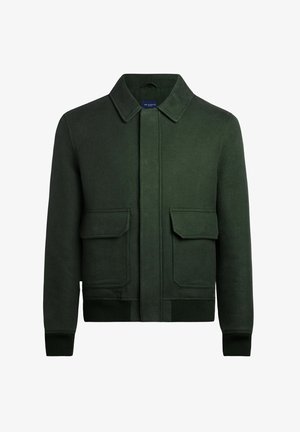 Veste verte en mélange de laine avec un col, deux poches avant, et des poignets et une base côtelés pour plus de texture et une meilleure tenue.