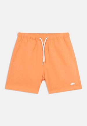 Oranžid lühikesed püksid elastse taljega, valge nööriga, küljetaskudega ja vasakul jalal väikese valge logoga valgel taustal.