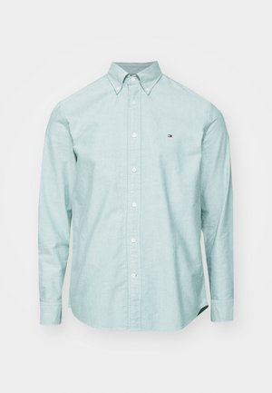 Hellgrünes Button-down-Hemd mit einem kragen, langen Ärmeln und einem kleinen Logo auf der Brust. Aus strukturiertem Stoff gefertigt.