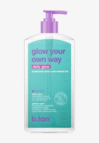 Clear pump bottle of b.tan Daily Glow tan gel with purple pump and teal label highlighting hyaluronic acid and pro-vitamin b5, vegan formula.