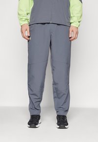 Under Armour LEGACY WINDBREAKER PANT - Szabadtéri nadrágok - castlerock/morph green