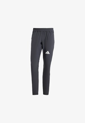 Gray athletic pants with a slim fit, elastic waistband, and white three-stripe logo on the left thigh. Made from lightweight fabric.