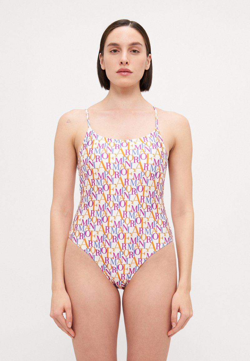 One-piece swimsuit with thin straps, featuring a colorful all-over text pattern in orange, pink, and purple on a white background.