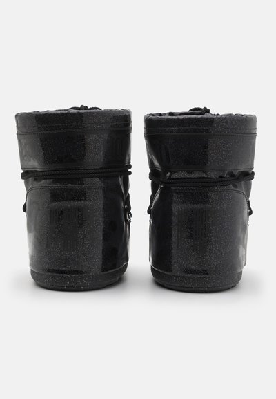 Black waterproof boots with a shiny finish, textured fabric, cinch closure, and speckled accents at the top and bottom edges.