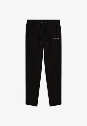 Pantaloni jogging neri realizzati in tessuto morbido, con una vita elasticizzata dotata di un cordoncino dorato, tasche laterali e un logo dorato sulla gamba sinistra.