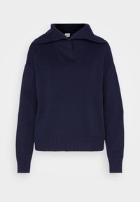 Navy blue sweater with a wide collar, v-neck, and ribbed cuffs. Made from a soft knit fabric, it features a relaxed fit and minimal design.