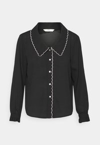 Blusa preta de mangas longas com colarinho serrilhado e acabamento branco, com botões na frente e punhos franzidos. Feita de tecido leve.