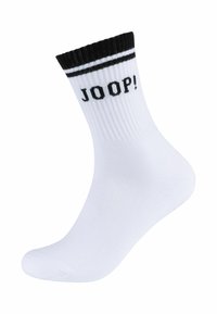 Hvid bomuldsstrømpe med sort stribet manchet og "JOOP!" logo trykt i sort. Glat tekstur, ankelhøjde, ribbet design ved toppen.