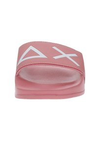 Infradito rosa realizzate in gomma con una superficie liscia, caratterizzate da design geometrici bianchi sulla cinghia e una suola leggermente rialzata.