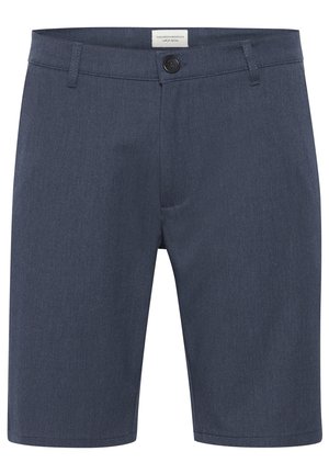 Meeste tumesinised kohandatud lühikesed püksid, millel on vöökohad, eesnupuga kinnitamine ja väike brändimärk vöökoha sees.