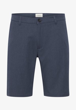 Meeste tumesinised kohandatud lühikesed püksid, millel on vöökohad, eesnupuga kinnitamine ja väike brändimärk vöökoha sees.