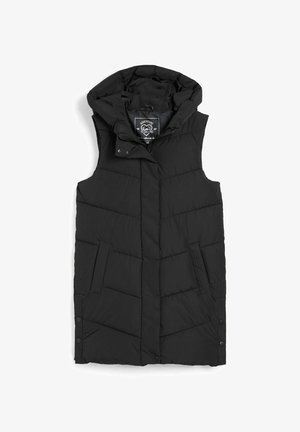 Czarna puchowa kamizelka z kapturem, z pikowanym wzorem, bocznymi kieszeniami i zatrzaskami na dole. Wewnątrz metka z napisem "Adventure Is Calling".