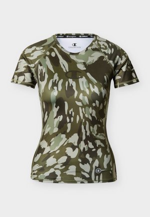 T-shirt de compression à manches courtes pour femmes avec motif camouflage vert et gris, logo Champion sur la poitrine et le bas du côté gauche.