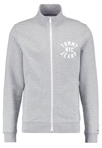 Grijze hoodie met rits gemaakt van zachte stof, met een opstaande kraag, geribde manchetten en een witte logo-print op de linker borst.