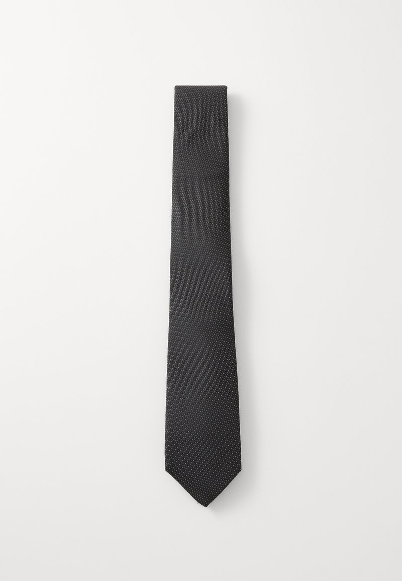 Melna taure ar smalku punktiņu rakstu, izgatavota no gludas auduma, ar smailu galu un šauru dizainu, lai radītu elegantu izskatu.