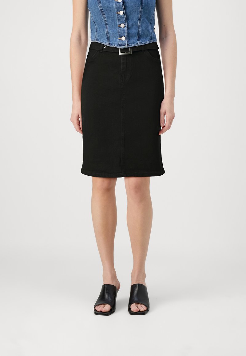 Black denim pencil skirt with a smooth texture, featuring a belt and front side pockets. Paired with black open-toe mules.