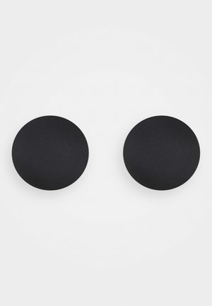 Mencionadas são bases circulares pretas com uma textura suave e mate. Elas são feitas de um material durável, projetadas para evitar escorregamentos.