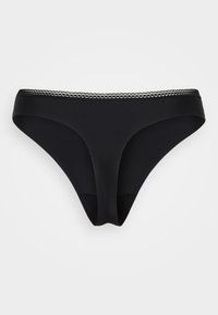 Zwarte naadloze bikini-stijl onderbroek met een kanten tailleband op een effen lichte achtergrond.