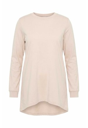Langærmet, lysebeige tunika med rund halsudskæring og let buet kant, vist på en ensfarvet hvid baggrund.