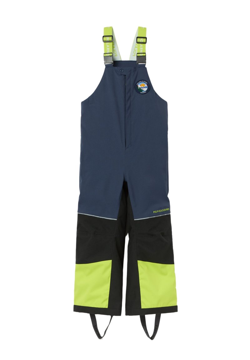 Tummansininen vedenpitävä haalari mustilla ja kirkkaan vihreillä yksityiskohdilla, säädettävät olkaimet ja edessä vetoketjukiinnitys. Logopatchi esillä.