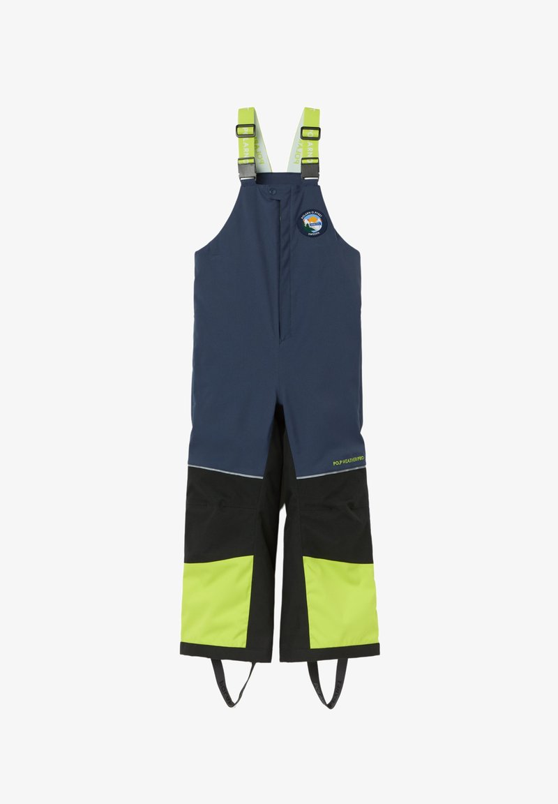 Tummansininen vedenpitävä haalari mustilla ja kirkkaan vihreillä yksityiskohdilla, säädettävät olkaimet ja edessä vetoketjukiinnitys. Logopatchi esillä.