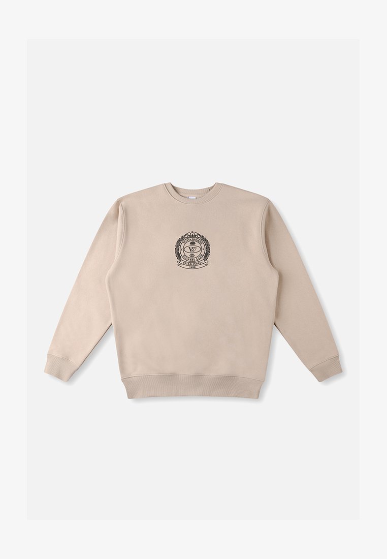 Bež dukserica s dugim rukavima, rebrastim ovratnikom i rubom, s centralno smještenim crnim amblemom s lovorovim detaljima. Glatka pamučna tekstura.