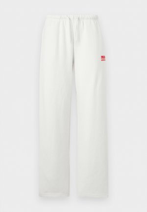 Valged elastse vöökohaga dressipüksid, sirgete säärtega ja väikese punase logoga paremal reiel, millel on kiri "RVCA SURF CO."