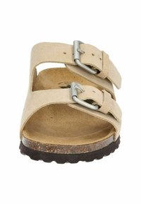 Beige suede sandals with two adjustable straps and metal buckles. Cork footbed with a textured rubber sole for grip and support.