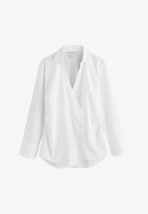 Balti marškiniai mygtukais, V formos iškirpte, ilgomis rankovėmis ir išlenktu apačios kraštu. Pagaminti iš lygaus audinio, turi klasikinį apykaklę ir užsegimą priekyje su mygtukais.