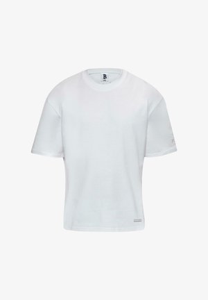 Biała bawełniana koszulka z okrągłym dekoltem i krótkimi rękawami. Prosty krój z małym logo po boku. Gładka tekstura.