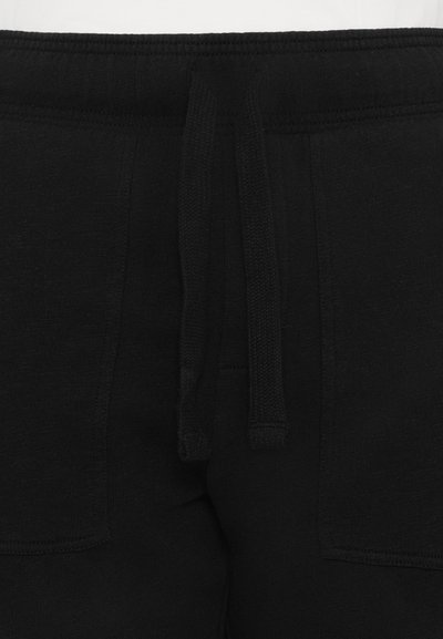 Schwarze Jogginghosen mit einem Kordelzugbund, die eine weiche Textur, seitliche Taschen und eine lockere Passform bieten.