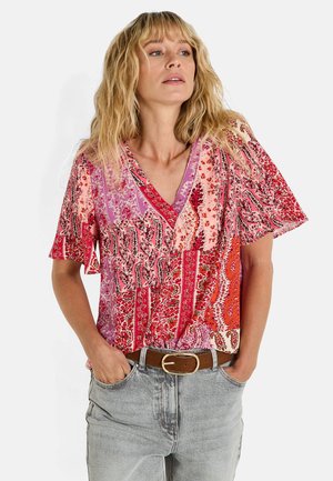 Blusa de manga corta con estampados florales y de cachemira multicolores, con escote en V y un corte relajado. Fabricada con tejido ligero.