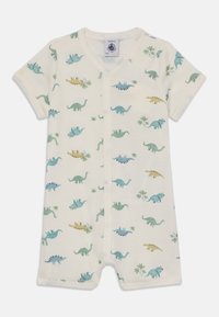 Kortermet babyromper i kremfarge laget av myk stoff, med fargerike dinosaurutskrifter og trykknapper foran.