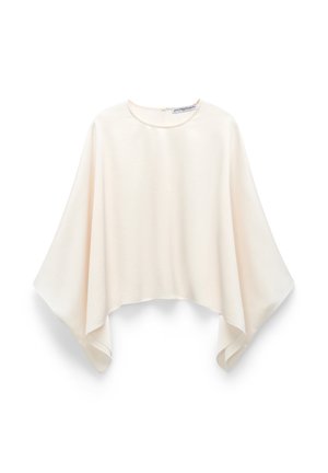 Cream-colored loose blouse with wide, flowing sleeves and a round neckline, displayed on a white background.
