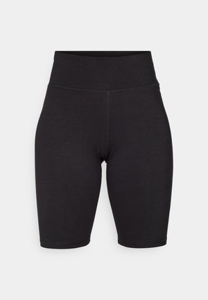 Sorte sykle shorts laget av elastisk stoff. Høy midje, glatt tekstur, knelengde med sømmer langs front og bak for struktur.