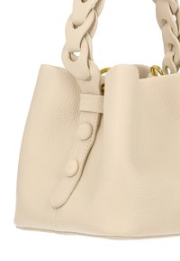 Beige leather handbag with a textured finish, featuring a chunky chain handle and button accents on the side.