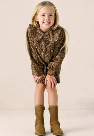 Leopard-print dress with frilled collar, long sleeves, and button front; paired with tan suede boots featuring a side zipper and strap detail.